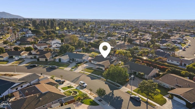 birds eye view of property featuring a mountain view