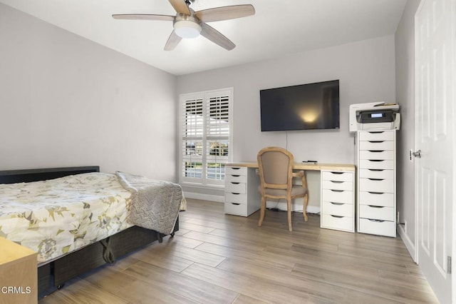 bedroom with ceiling fan and wood-type flooring