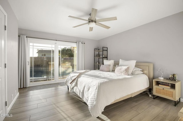 bedroom with access to exterior and ceiling fan