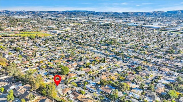 birds eye view of property with a mountain view