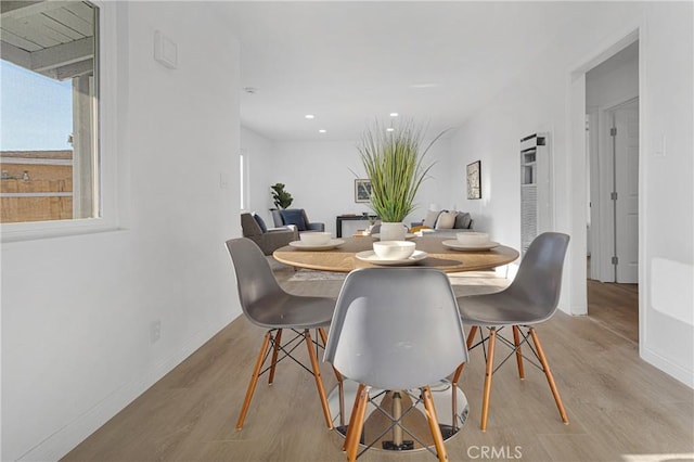 dining space with light wood-type flooring