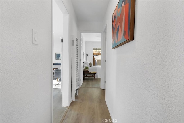 corridor featuring light wood-type flooring