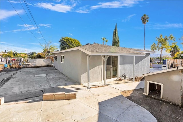 back of house with a patio area