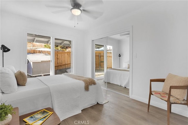 bedroom featuring a closet, ceiling fan, and light hardwood / wood-style flooring