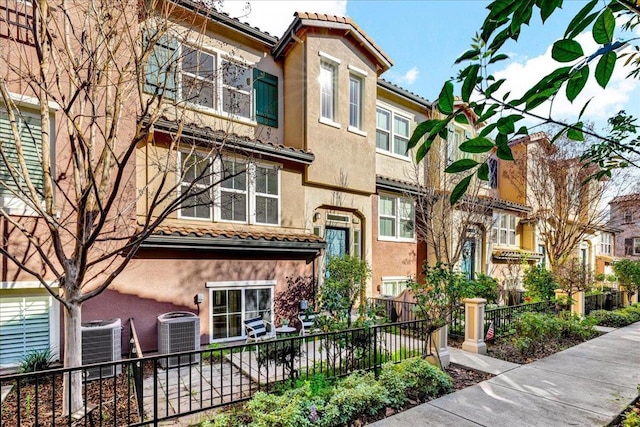 view of front of property with central AC unit