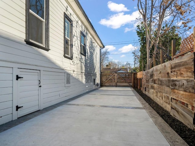 view of side of home with a patio