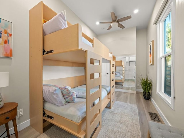 bedroom featuring ceiling fan and light hardwood / wood-style flooring