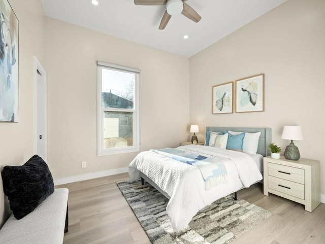 bedroom with ceiling fan and light wood-type flooring