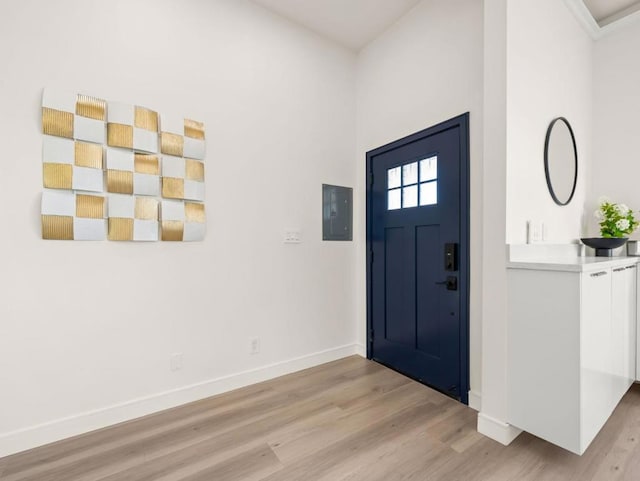 entryway featuring electric panel and light hardwood / wood-style floors