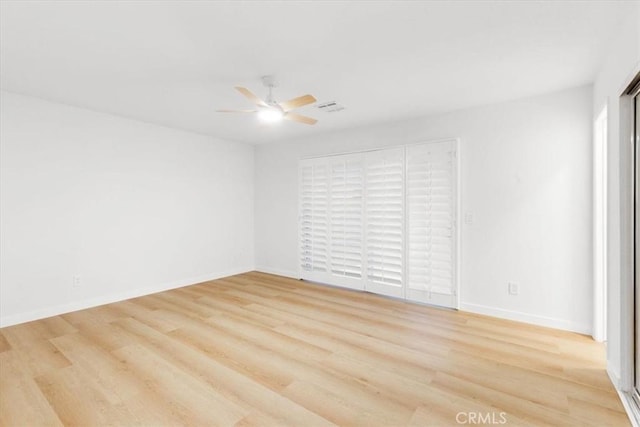 empty room featuring light hardwood / wood-style floors and ceiling fan