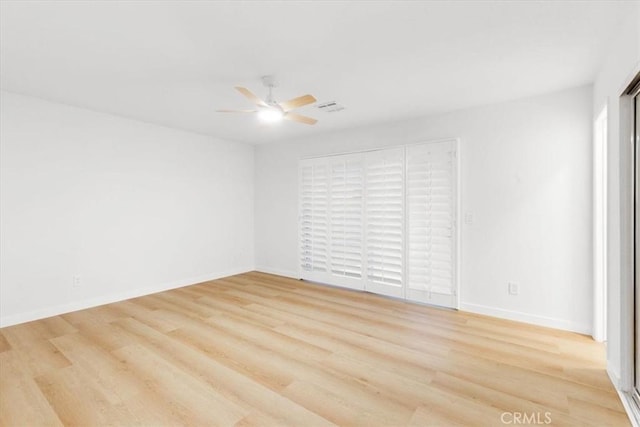 2173 N Viminal Rd, Palm Springs, CA 92262 - spare room featuring a ceiling fan, light wood-style flooring, and baseboards