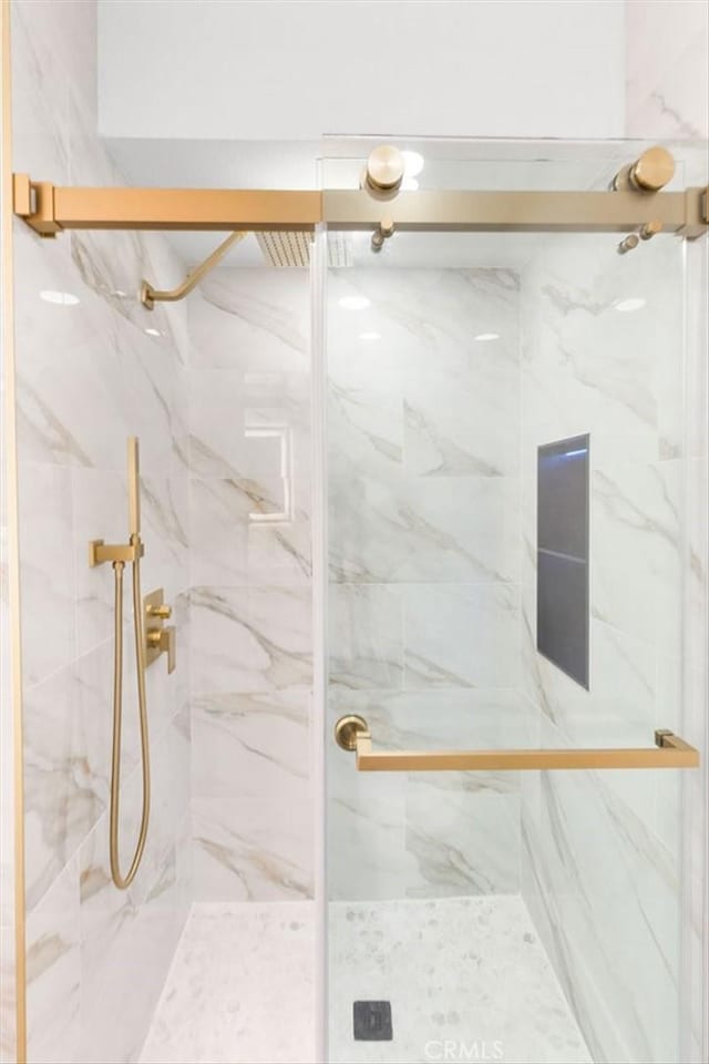 bathroom featuring walk in shower