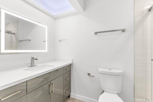 2173 N Viminal Rd, Palm Springs, CA 92262 - full bathroom with vanity, toilet, baseboards, and a shower