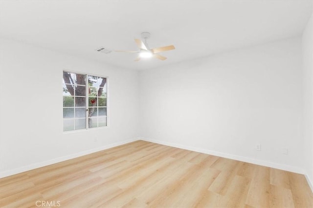 2173 N Viminal Rd, Palm Springs, CA 92262 - empty room featuring wood finished floors, a ceiling fan, and baseboards