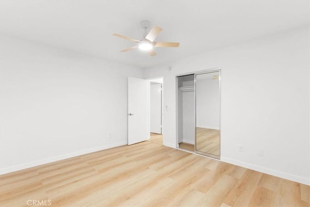 2173 N Viminal Rd, Palm Springs, CA 92262 - unfurnished bedroom with wood finished floors, baseboards, a closet, and a ceiling fan