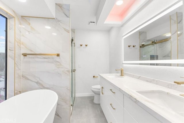 2173 N Viminal Rd, Palm Springs, CA 92262 - bathroom featuring a marble finish shower, a freestanding bath, double vanity, toilet, and baseboards