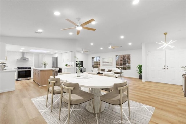 2173 N Viminal Rd, Palm Springs, CA 92262 - dining space with vaulted ceiling, light wood-style flooring, a ceiling fan, and recessed lighting