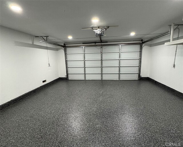 2173 N Viminal Rd, Palm Springs, CA 92262 - garage with a garage door opener, baseboards, and recessed lighting
