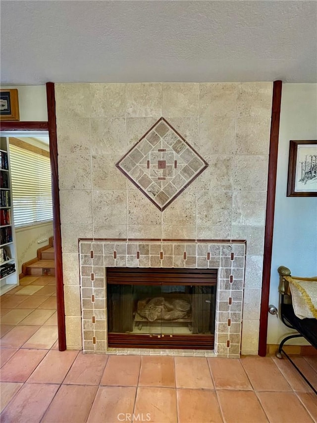 details with a textured ceiling and a fireplace