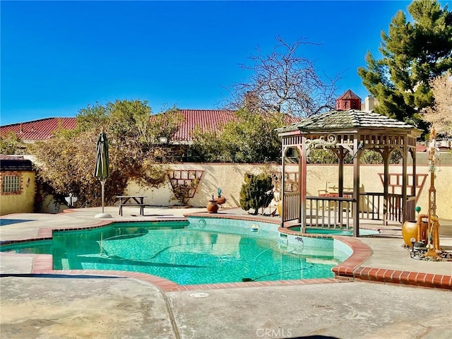 view of pool with a gazebo and a patio area