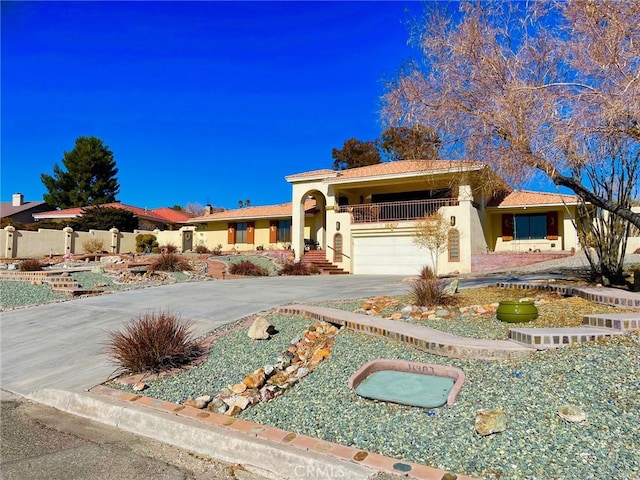 mediterranean / spanish house featuring a garage