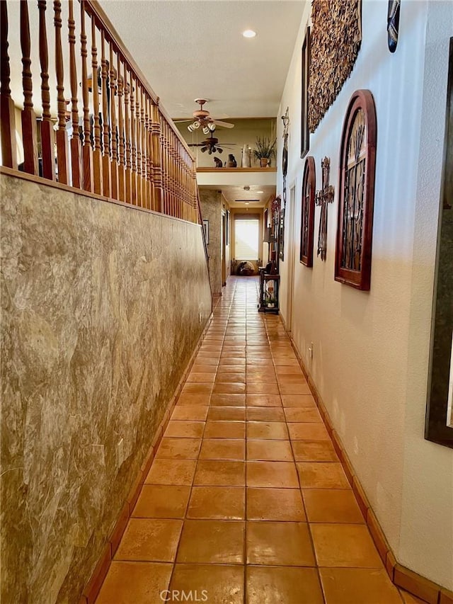 hallway with tile patterned floors