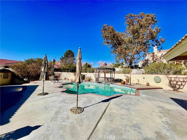 view of pool featuring a gazebo and a patio area