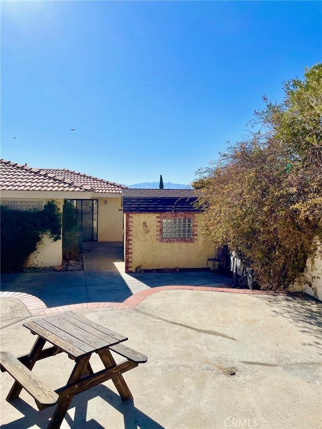 view of front of house with a patio