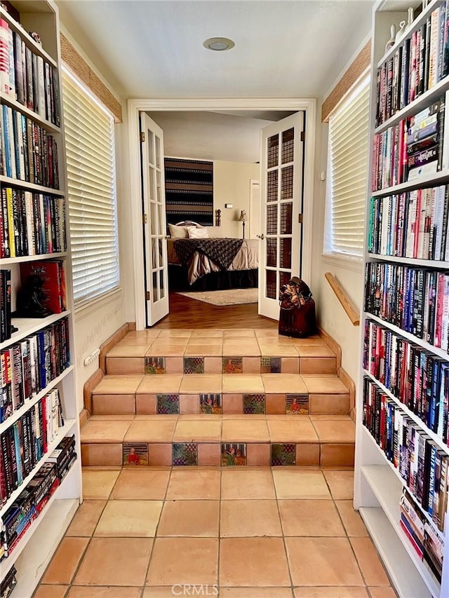 sitting room with french doors and tile patterned flooring