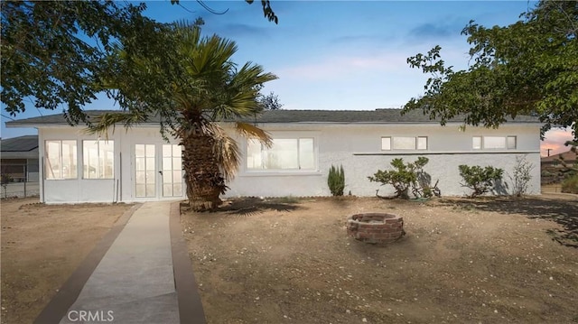 view of front of home featuring a fire pit