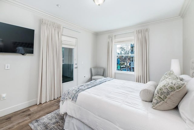 bedroom with crown molding and wood-type flooring