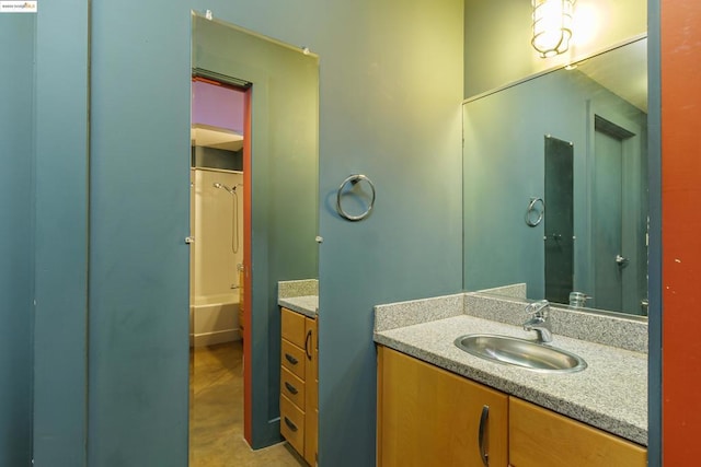 bathroom with vanity and washtub / shower combination