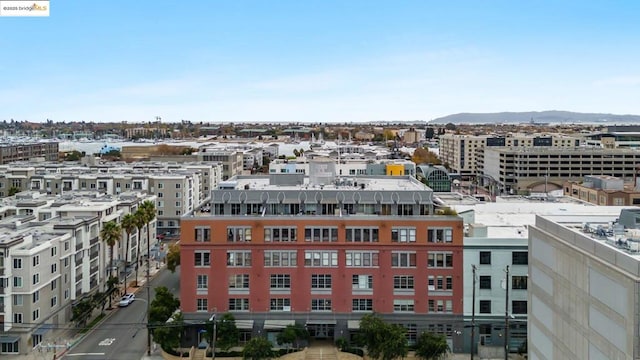 property's view of city featuring a mountain view