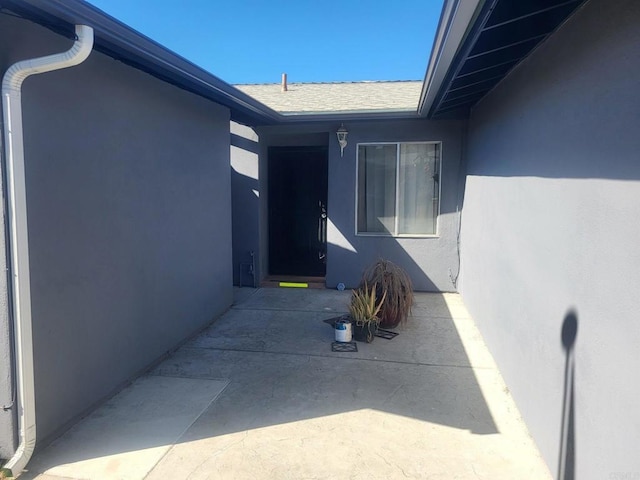 property entrance with a patio