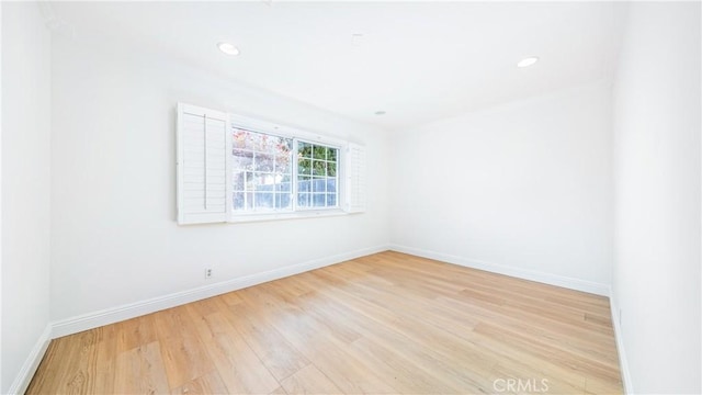 unfurnished room featuring light hardwood / wood-style floors