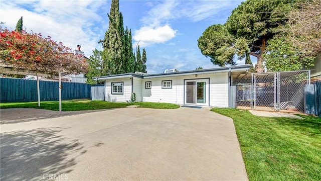 view of front of property featuring a patio area and a front lawn