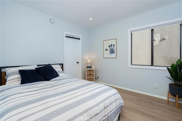 bedroom with light wood-type flooring