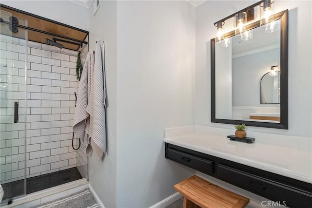 bathroom featuring vanity, ornamental molding, and walk in shower