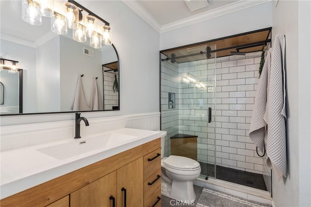 bathroom featuring vanity, a shower with shower door, and ornamental molding