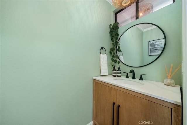 bathroom with vanity and crown molding