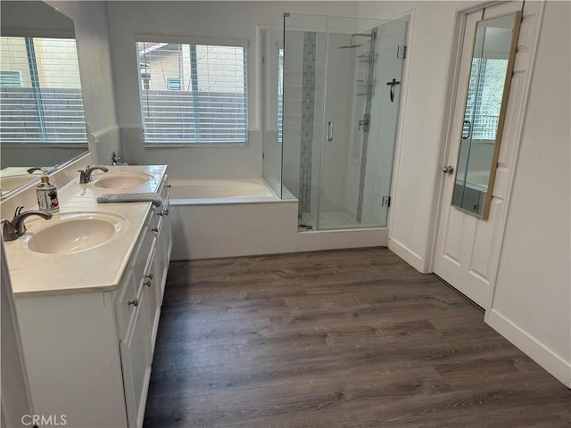 bathroom with vanity, wood-type flooring, and separate shower and tub