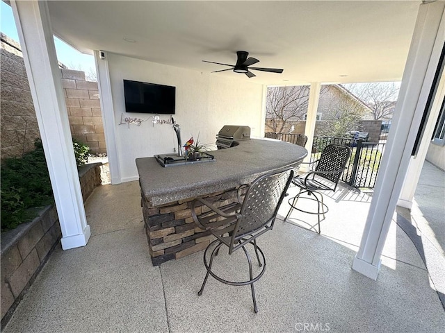 view of patio / terrace featuring outdoor dining space and ceiling fan