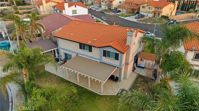 birds eye view of property with a residential view