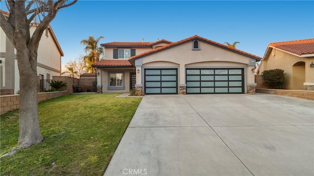 mediterranean / spanish-style house with stucco siding, concrete driveway, an attached garage, a front yard, and fence