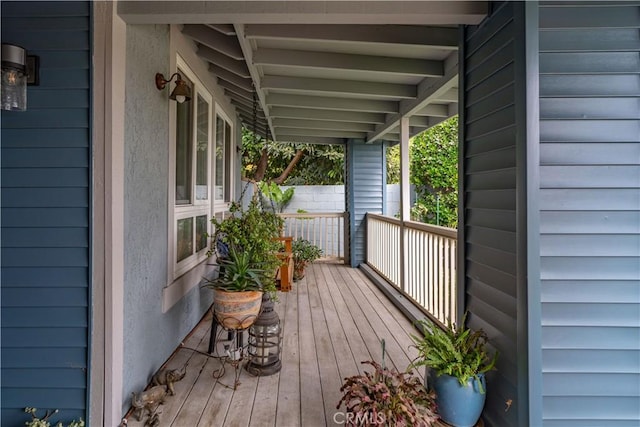 wooden deck featuring covered porch