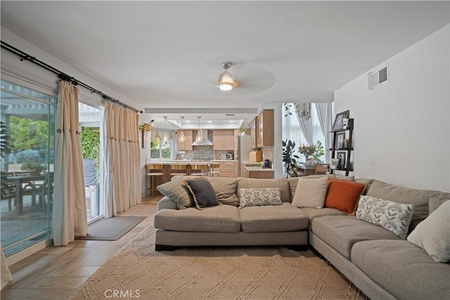 living room with light hardwood / wood-style flooring