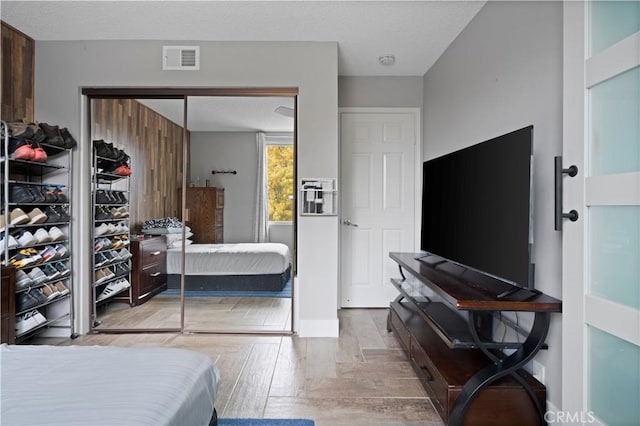 bedroom with light hardwood / wood-style floors