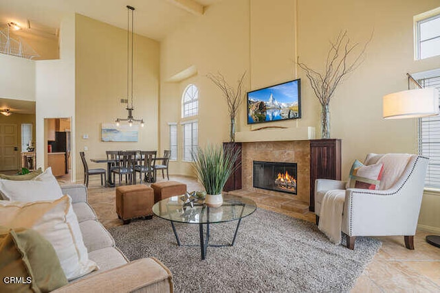 living room featuring a high ceiling and beam ceiling