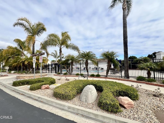 surrounding community featuring fence and a pool