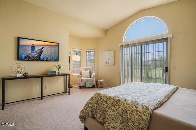 bedroom with vaulted ceiling, carpet, and access to exterior